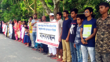 নড়াইলে হাইভোল্টেজ বৈদ্যুতিক লাইন অপসারণের দাবিতে মানববন্ধন