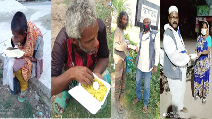 শার্শার অভুক্ত ভিক্ষুক, পাগল, প্রতিবন্ধী ও ভবঘুরেদের মুখে খাবার তুলে দিচ্ছেন মিজান। -ছবি একুশে টিভি।