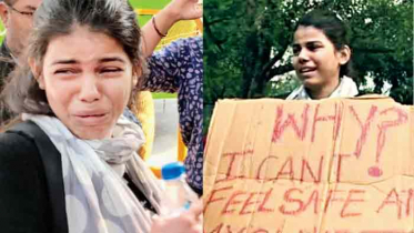 ভারতের সংসদের সামনে কলেজ ছাত্রীর প্রতিবাদ