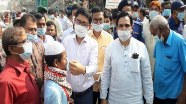 জয়পুরহাটে করোনা সচেতনতায় মাস্ক ও লিফলেট বিতরণ