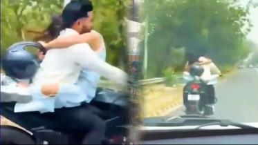 বান্ধবীকে কোলে নিয়ে বাইক চালনা,  ৭৫ হাজার টাকা জরিমানা করল পুলিশ