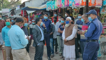 হিলিতে মাস্কবিহিন চলাচল করায় ৯ জনকে জরিমানা 