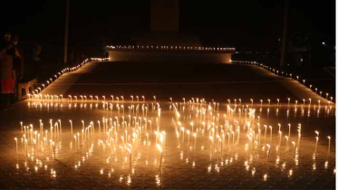 শহীদ বুদ্ধিজীবীদের স্মরণে নওগাঁয় মোমবাতি প্রজ্জলন